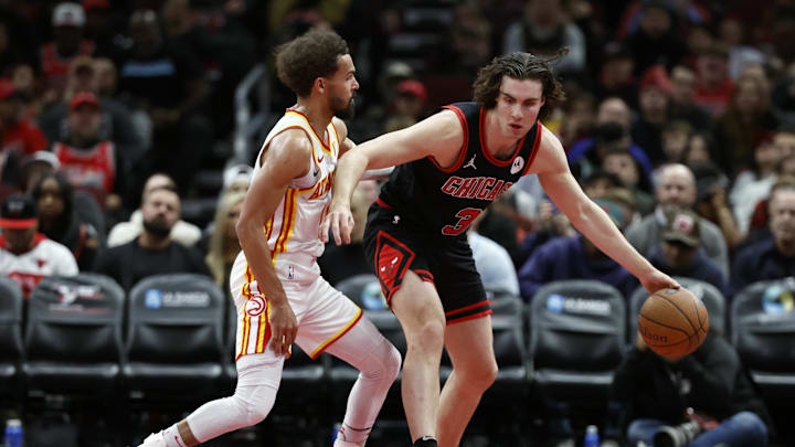 Nov 22, 2024; Chicago, Illinois, USA; Atlanta Hawks guard Trae Young (11) defends against Chicago Bulls guard Josh Giddey (3) during the second half at United Center. Mandatory Credit: Kamil Krzaczynski-Imagn Images