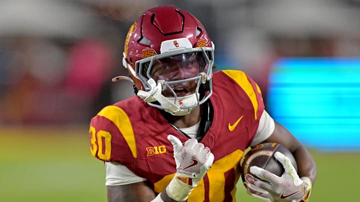 Oct 11, 2025; Los Angeles, California, USA; USC Trojans running back King Miller (30) runs for a touchdown in the second half against the Michigan Wolverines at United Airlines Field at the Los Angeles Memorial Coliseum. Mandatory Credit: Jayne Kamin-Oncea-Imagn Images