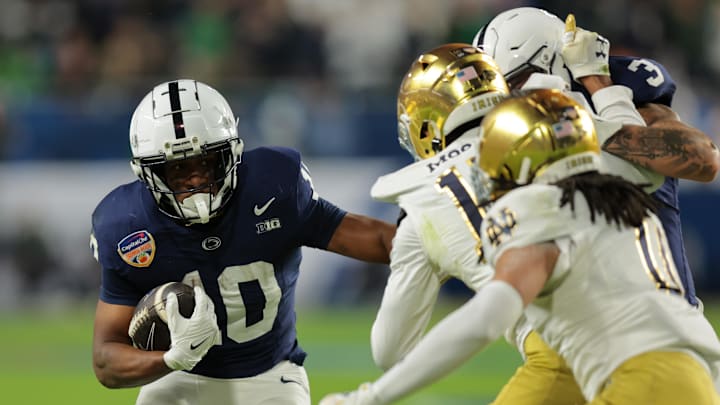Penn State running back Nicholas Singleton carries the ball against Notre Dame in the Orange Bowl.