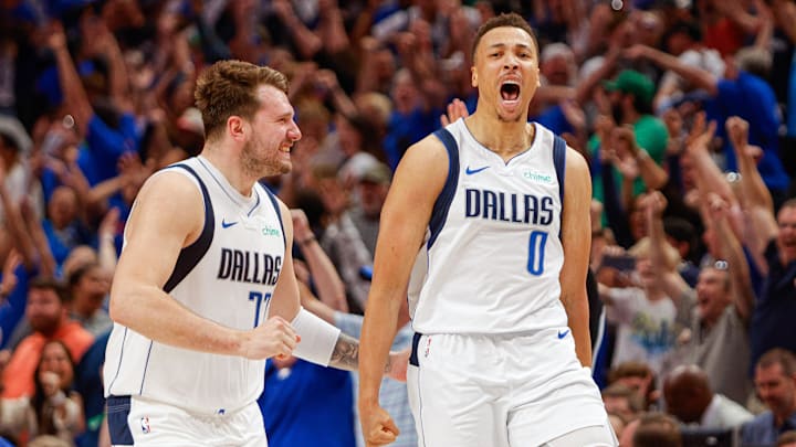 Apr 7, 2024; Dallas, Texas, USA; Dallas Mavericks guard Luka Doncic (77) celebrates with guard Dante Exum (0) after a three-point basket at the end of regulation against the Houston Rockets at American Airlines Center. Mandatory Credit: Andrew Dieb-Imagn Images