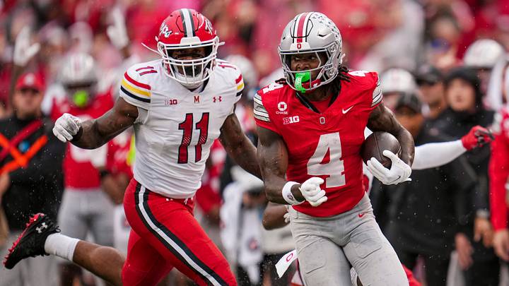 Ohio State Buckeyes wide receiver Jeremiah Smith (4) scores a touchdown past Maryland Terrapins defensive back Messiah Delhomme (33) during the NCAA football game at Ohio Stadium in Columbus on Oct. 10, 2026. Ohio State Buckeyes wide receiver Jeremiah Smith (4) scores a touchdown past Maryland Terrapins defensive back Messiah Delhomme (33) during the NCAA football game at Ohio Stadium in Columbus on Oct. 10, 2026.