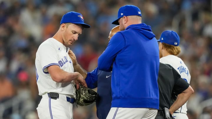 Jun 29, 2024; Toronto, Ontario, CAN; Toronto Blue Jays pitcher Chris Bassitt (40) gets his arm examined by the trainer after being hit with a pitch during the first inning against the New York Yankees at Rogers Centre. Mandatory Credit: Kevin Sousa-USA TODAY Sports