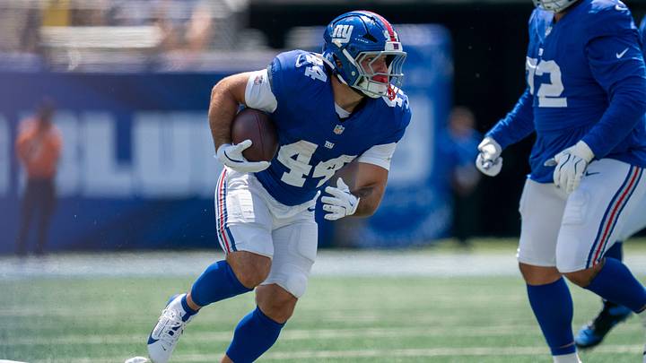 Running back Cam Skattebo runs with the ball during the Giants’ preseason opener.