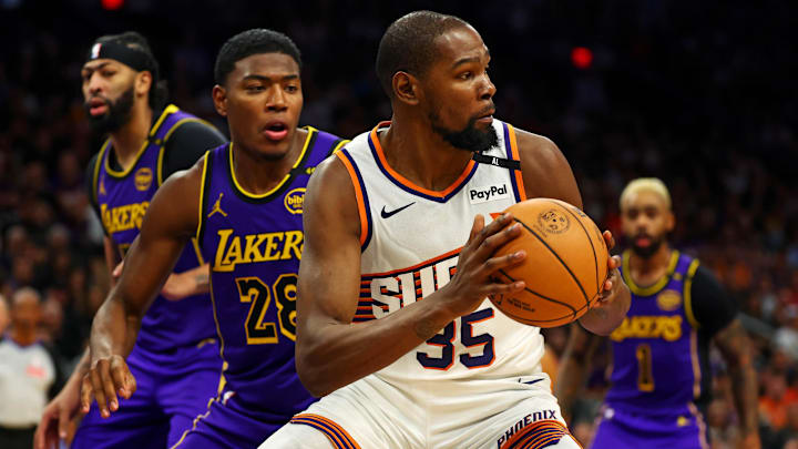 Oct 28, 2024; Phoenix, Arizona, USA; Phoenix Suns forward Kevin Durant (35) handles the ball against Los Angeles Lakers forward Rui Hachimura (28) during the second half at Footprint Center. Mandatory Credit: Mark J. Rebilas-Imagn Images