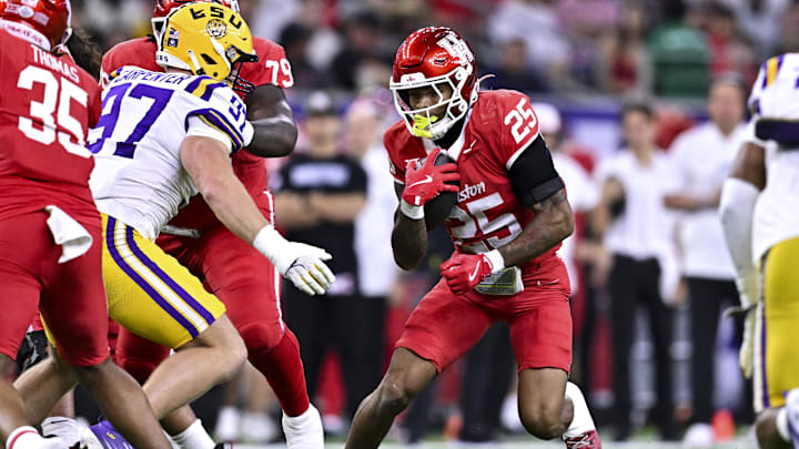 Dec 27, 2025; Houston, TX, USA; Houston Cougars running back DJ Butler (25) runs the ball during the first half against the Louisiana State Tigers at NRG Stadium. Mandatory Credit: Maria Lysaker-Imagn Images 