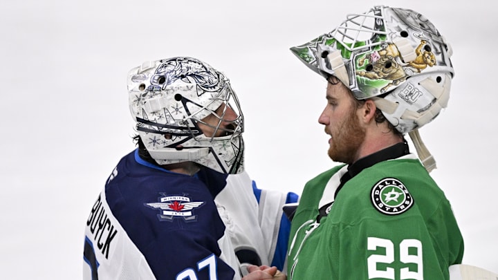 May 17, 2025; Dallas, Texas, USA; Winnipeg Jets goaltender Connor Hellebuyck (37) shakes hands with Dallas Stars goaltender Jake Oettinger (29) after the Stars defeat the Jets in the overtime period in game six of the second round of the 2025 Stanley Cup Playoffs at American Airlines Center. Mandatory Credit: Jerome Miron-Imagn Images