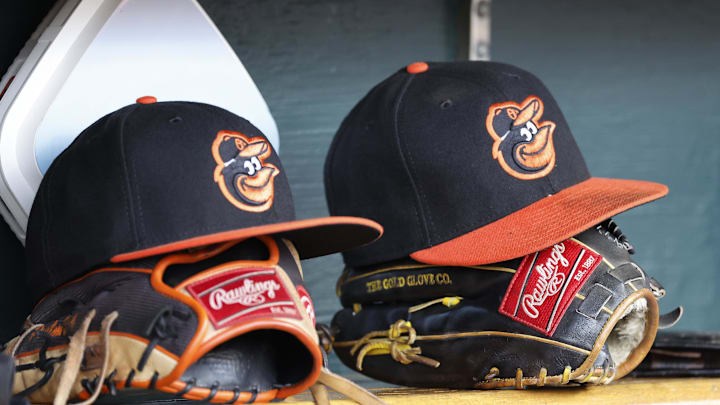 Apr 27, 2023; Detroit, Michigan, USA; Baltimore Orioles hats and glove sits in dugout in the second inning against the Detroit Tigers at Comerica Park. Mandatory Credit: Rick Osentoski-Imagn Images Apr 27, 2023; Detroit, Michigan, USA; Baltimore Orioles hats and glove sits in dugout in the second inning against the Detroit Tigers at Comerica Park. Mandatory Credit: Rick Osentoski-Imagn Images