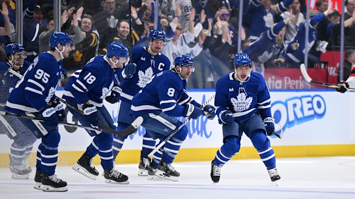 Apr 22, 2025; Toronto, Ontario, CAN;  Toronto Maple Leafs forward Max Domi (11) celebrates with team mates after scoring the winning goal in overtime against the Ottawa Senators in game two of the first round of the 2025 Stanley Cup Playoffs at Scotiabank Arena. Mandatory Credit: Dan Hamilton-Imagn Images