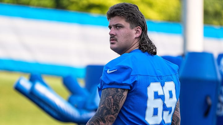 Detroit Lions guard Tate Ratledge (69) walks onto the field for practice during training camp at Meijer Performance Center in Allen Park on Monday, July 21, 2025.