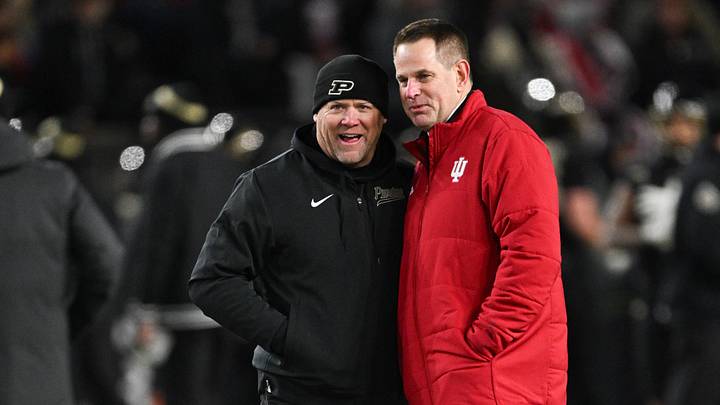 Nov 28, 2025; West Lafayette, Indiana, USA; Purdue Boilermakers head coach Barry Odom and Indiana Hoosiers head coach Curt Cignetti speak before the game at Ross-Ade Stadium. Mandatory Credit: Marc Lebryk-Imagn Images