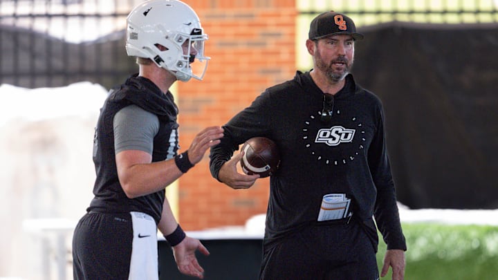 Quarterbacks coach Tim Rattay works with players during an Oklahoma State football practice in Stillwater, Okla., on Wednesday, July 31, 2024. Quarterbacks coach Tim Rattay works with players during an Oklahoma State football practice in Stillwater, Okla., on Wednesday, July 31, 2024.