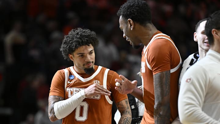Texas Longhorns guard Jordan Pope celebrates with forward Nic Codie after defeating the Gonzaga Bulldogs during a second round game of the men's 2026 NCAA Tournament at Moda Center.