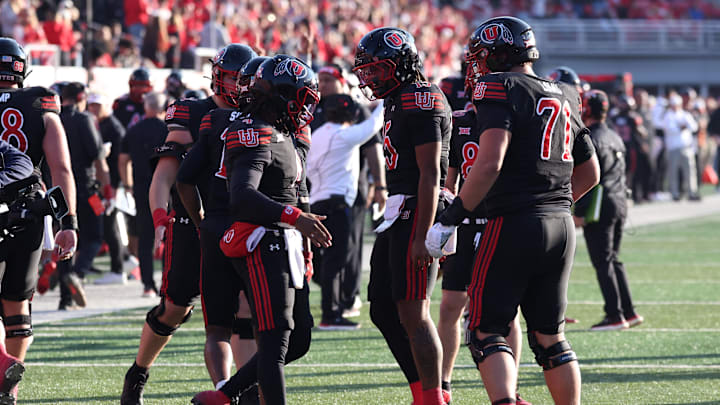 Utah Utes quarterback Devon Dampier (4) celebrates scoring a touchdown against the Kansas State Wildcats during the first half at Rice-Eccles Stadium.