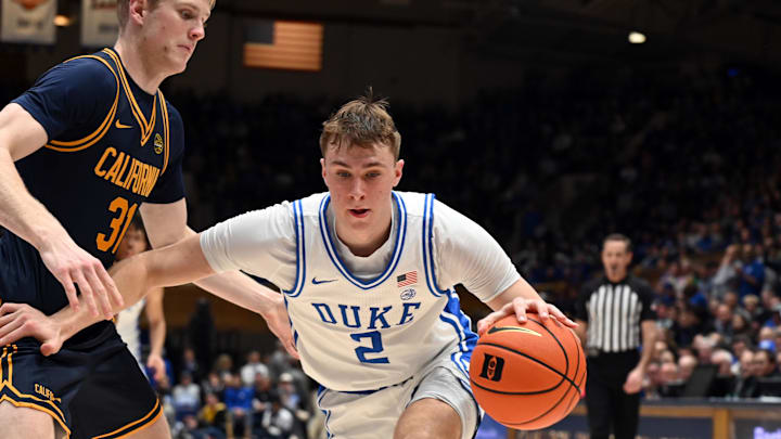 Feb 12, 2025; Durham, North Carolina, USA; Duke Blue Devils forward Cooper Flagg (2) controls the ball in front of California Golden Bears forward Rytis Petraitis (31) during the second half at Cameron Indoor Stadium. Mandatory Credit: Rob Kinnan-Imagn Images Feb 12, 2025; Durham, North Carolina, USA; Duke Blue Devils forward Cooper Flagg (2) controls the ball in front of California Golden Bears forward Rytis Petraitis (31) during the second half at Cameron Indoor Stadium. Mandatory Credit: Rob Kinnan-Imagn Images