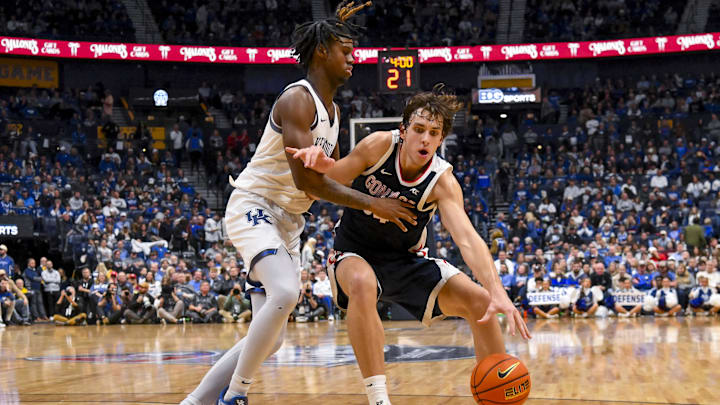 Dec 5, 2025; Nashville, TN, USA;  Gonzaga Bulldogs forward Braden Huff (34) drives to the basket past Kentucky Wildcats guard Jasper Johnson (2) during the second half at Bridgestone Arena. Mandatory Credit: Steve Roberts-Imagn Images