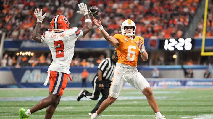 Tennessee quarterback Joey Aguilar (6) throws the ball as Syracuse defensive back Duce Chestnut (2) defends during the Aflac Kickoff Game between the Volunteers and Syracuse held at Mercedes-Benz Stadium in Atlanta, Ga., on August 30, 2025.