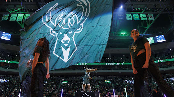 Feb 8, 2024; Milwaukee, Wisconsin, USA; Milwaukee Bucks mascot Bango waves a flag with the Milwaukee Bucks logo prior to the game against the Minnesota Timberwolves at Fiserv Forum. Mandatory Credit: Jeff Hanisch-Imagn Images Feb 8, 2024; Milwaukee, Wisconsin, USA; Milwaukee Bucks mascot Bango waves a flag with the Milwaukee Bucks logo prior to the game against the Minnesota Timberwolves at Fiserv Forum. Mandatory Credit: Jeff Hanisch-Imagn Images