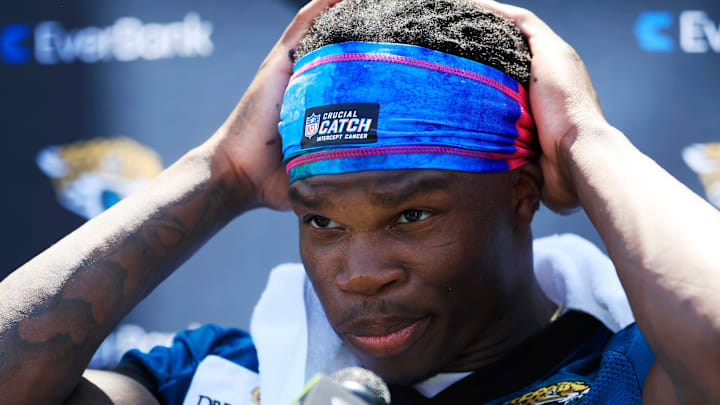 Jacksonville Jaguars wide receiver Travis Hunter (12) adjusts his headband before speaking to members of the media during the second mandatory minicamp at Miller Electric Center Wednesday, June 11, 2025 in Jacksonville, Fla. Jacksonville Jaguars wide receiver Travis Hunter (12) adjusts his headband before speaking to members of the media during the second mandatory minicamp at Miller Electric Center Wednesday, June 11, 2025 in Jacksonville, Fla.