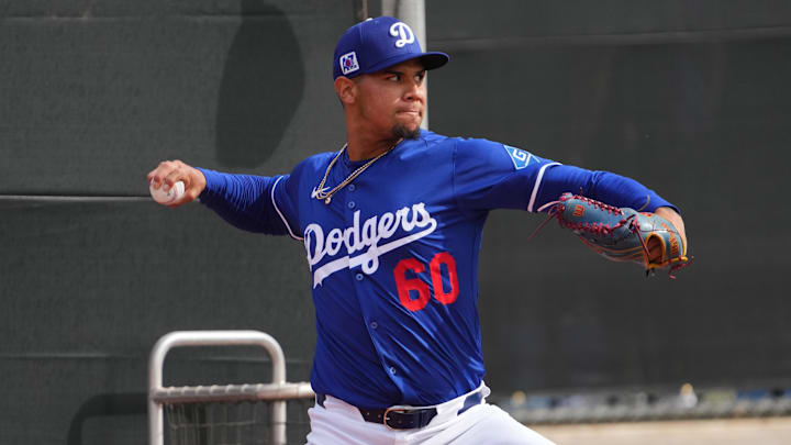 Feb 13, 2025; Glendale, AZ, USA; Los Angeles Dodgers pitcher Edgardo Henriquez (60) throws during a Spring Training workout at Camelback Ranch Mandatory Credit: Joe Camporeale-Imagn Images