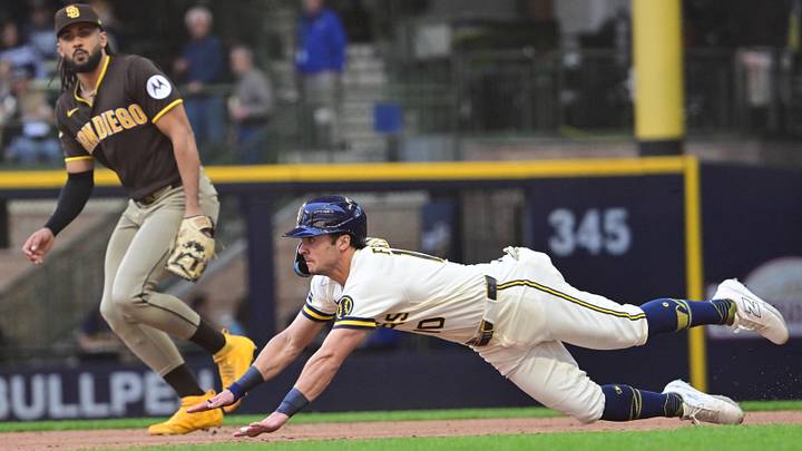 May 14, 2026; Milwaukee, Wisconsin, USA; Milwaukee Brewers right fielder Sal Frelick (10) attempts to steal second base in the third inning against the San Diego Padres at American Family Field. Mandatory Credit: Benny Sieu-Imagn Images