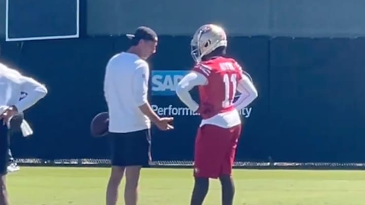 San Francisco 49ers coach Kyle Shanahan (left) speaks to wide receiver Brandon Aiyuk (right) during the team's practice session on Friday, September 27. 