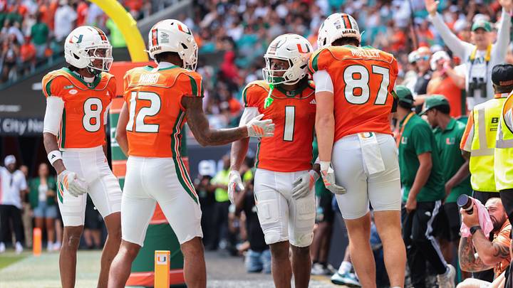 Oct 24, 2026; Miami Gardens, Florida, USA; Miami Hurricanes wide receiver Malachi Toney (1) celebrates with wide receiver Somourian Wingo (12), tight end Gavin Mueller (87) and wide receiver Vandrevius Jacobs (8) after scoring a touchdown against the Pittsburgh Panthers during the second quarter at Hard Rock Stadium. Mandatory Credit: Sam Navarro-Imagn Images