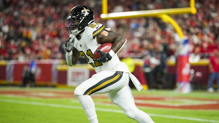 Oct 7, 2024; Kansas City, Missouri, USA; New Orleans Saints running back Jamaal Williams (21) returns a kickoff during the first half against the Kansas City Chiefs at GEHA Field at Arrowhead Stadium. Mandatory Credit: Jay Biggerstaff-Imagn Images