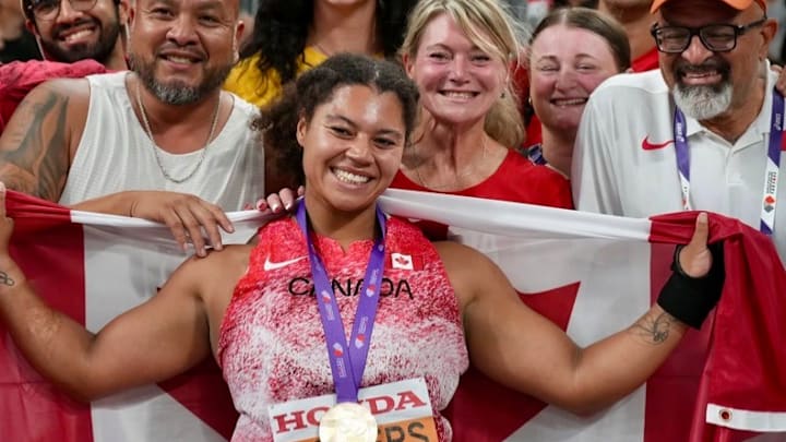 Camryn Rogers celebrates with her coach and family