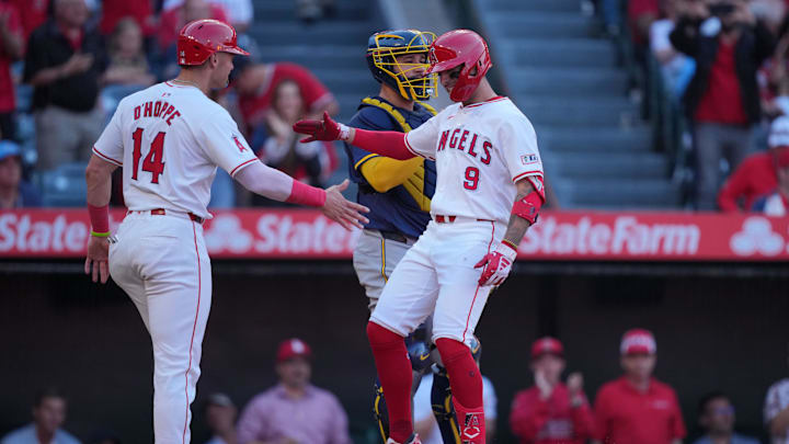 Jun 17, 2024; Anaheim, California, USA; Los Angeles Angels shortstop Zach Neto (9) celebrates with catcher Logan O'Hoppe (14) after hitting a two-run home run in the fourth inning as Milwaukee Brewers catcher Gary Sanchez (99) watches  at Angel Stadium. Mandatory Credit: Kirby Lee-Imagn Images