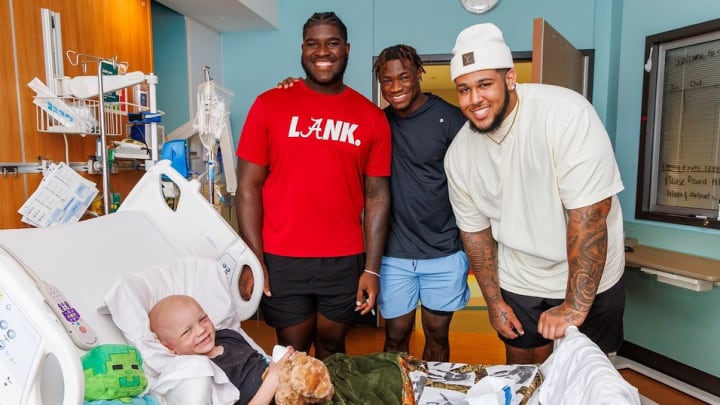 Alabama football players Jalen Milroe, Tyler Booker and Kadyn Proctor visiting Children's of Alabama