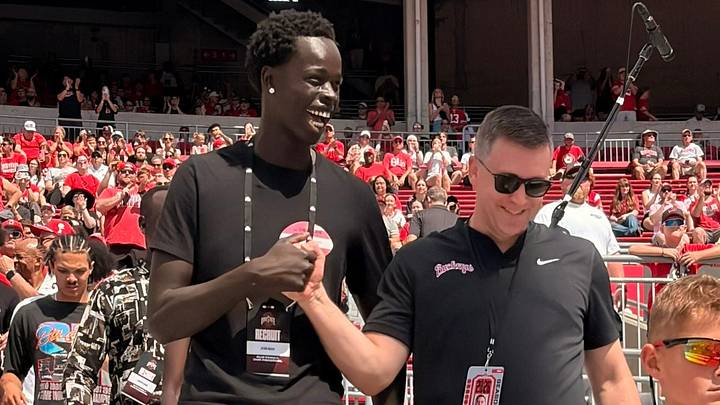 Deng Ngor, a prospect in the 2027 class, walks into Ohio Stadium with men's basketball coach Jake Diebler on Sept. 5, 2026. Deng Ngor, a prospect in the 2027 class, walks into Ohio Stadium with men's basketball coach Jake Diebler on Sept. 5, 2026.