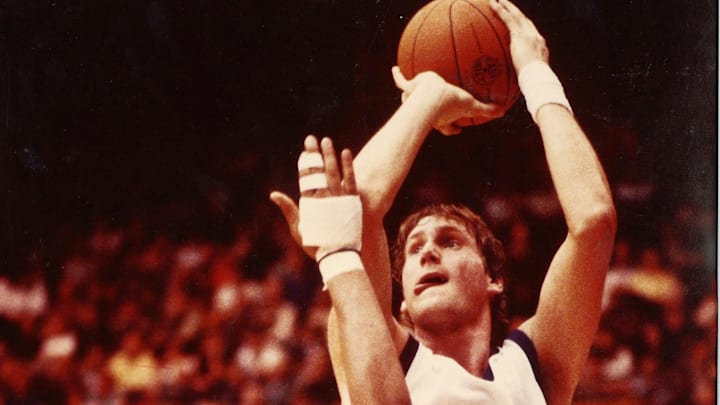 Christian Welp shoots a jumper for the Huskies. 