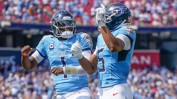 Tennessee Titans wide receiver Elic Ayomanor (5) celebrate swith Tennessee Titans quarterback Cam Ward (1) after a touchdown against the Los Angeles Rams during the second quarter at Nissan Stadium in Nashville, Tenn., Sunday, Sept. 14, 2025.