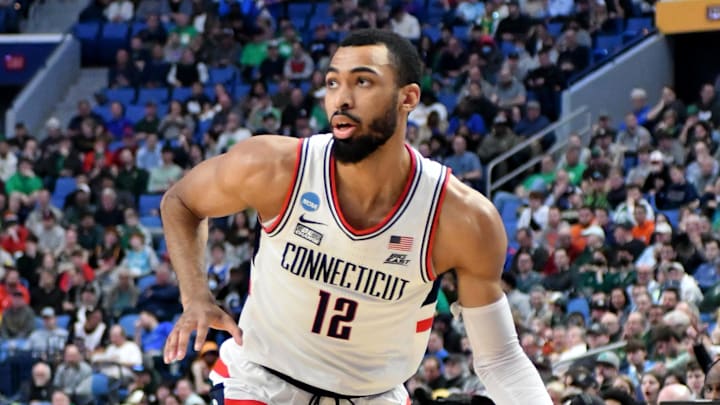 Mar 17, 2022; Buffalo, NY, USA; Connecticut Huskies forward Tyler Polley (12) dribbles in the first half against the New Mexico State Aggies during the first round of the 2022 NCAA Tournament at KeyBank Center. Mandatory Credit: Mark Konezny-Imagn Images Mar 17, 2022; Buffalo, NY, USA; Connecticut Huskies forward Tyler Polley (12) dribbles in the first half against the New Mexico State Aggies during the first round of the 2022 NCAA Tournament at KeyBank Center. Mandatory Credit: Mark Konezny-Imagn Images