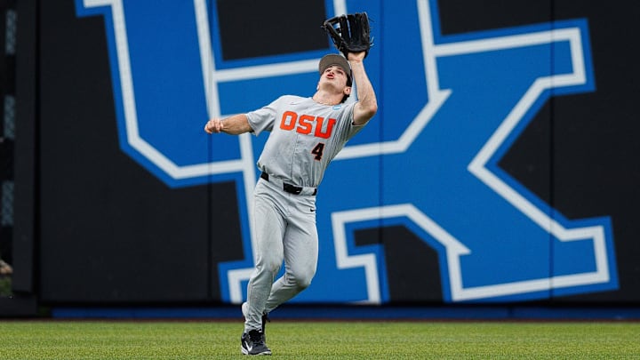 Jun 8, 2024; Lexington, KY, USA; Oregon State Beavers infielder Dallas Macias (4) makes a catch in the outfield during the sixth inning against the Kentucky Wildcats at Kentucky Proud Park. Mandatory Credit: Jordan Prather-Imagn Images