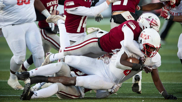 Wadley's Jaquez Wilkes (6) is taken down by multiple defenders during the Class 1A football state championship at Protective Stadium in Birmingham, Ala., on Thursday, Dec. 5, 2024. Wadley leads Maplesville 18-0 at halftime.