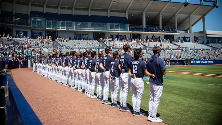 Auburn Tigers players line up for the National Anthem as Auburn Tigers take on Texas A&M Aggies during the SEC baseball tournament at Hoover Met in Birmingham, Ala., on Thursday, May 22, 2025.