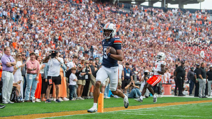 Auburn quarterback Deuce Knight (9) runs into the end zone for a touchdown against the Mercer Bears