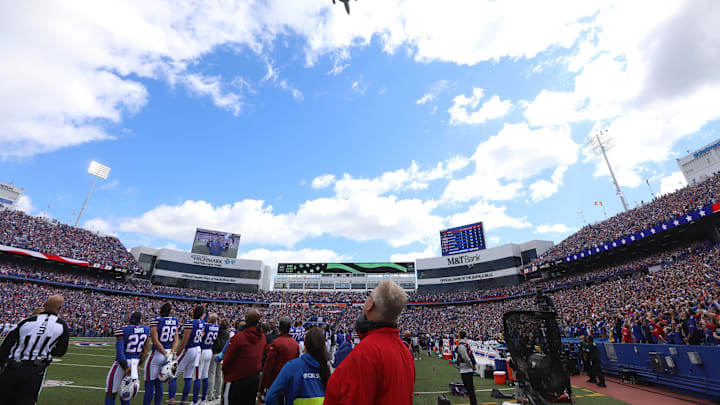 A military plane flies over Highmark Stadium during the singing of the national anthem during the Bills home opener against Arizona at Highmark Stadium in Orchard Park on Sept. 8, 2024.