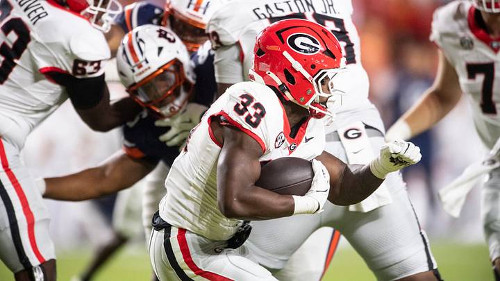 Georgia Bulldogs running back Chauncey Bowens (33) runs the ball as Auburn Tigers take on Georgia Bulldogs at Jordan-Hare Stadium in Auburn, Ala. on Saturday, Oct. 11, 2025. Auburn Tigers lead Georgia Bulldogs 10-3 at halftime.