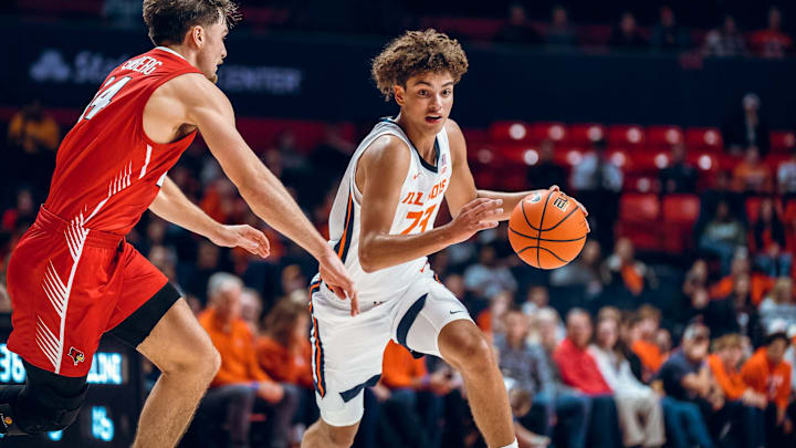 Illinois freshman guard Keaton Wagler (23) drives on an Illinois State defender in the Illini's 92-65 exhibition win over the Redbirds at State Farm Center in Champaign, Illinois.