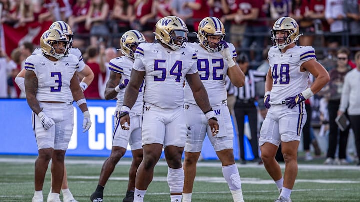 Anterio Thompson (54) is shown at WSU with Buddah Al-Uqdah (3), Bryce Butler (92) and Jacob Lane (48).