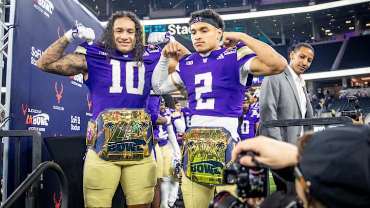 Xe'ree Alexander and Demond Williams Jr. show off their MVP awards at the LA Bowl. 