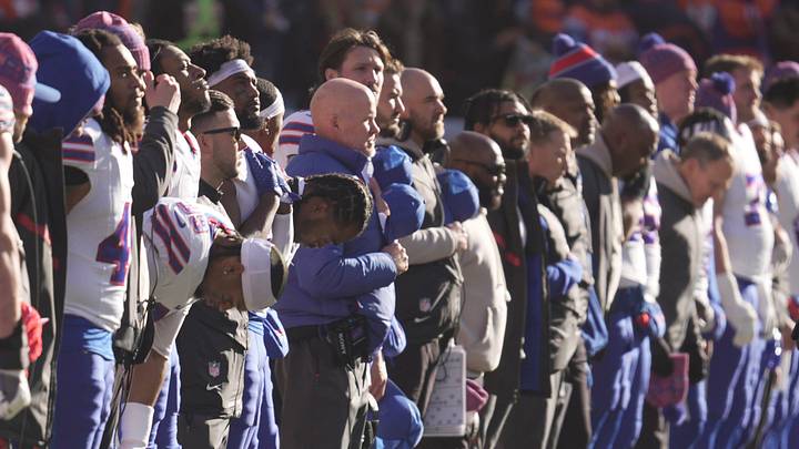 Buffalo Bills players and coaches line up for the singing of the national anthem before the start of their divisional game against the Denver Broncos at Empower Field at Mile High in Denver, Colorado on Jan. 17, 2026. Buffalo Bills players and coaches line up for the singing of the national anthem before the start of their divisional game against the Denver Broncos at Empower Field at Mile High in Denver, Colorado on Jan. 17, 2026.