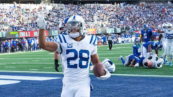 Dec 29, 2024; East Rutherford, New Jersey, USA; Indianapolis Colts running back Jonathan Taylor (28) scoring a 2nd quarter touchdown against the New York Giants at MetLife Stadium. Mandatory Credit: Robert Deutsch-Imagn Images
