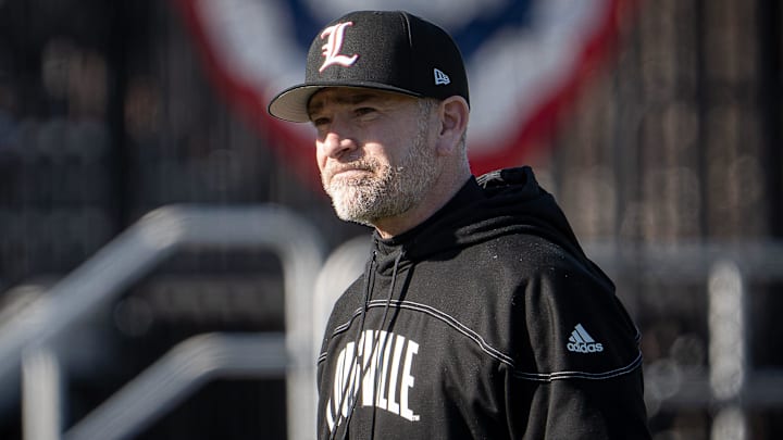 Louisville head coach Dan McDonnell walks to the dugout after conferring at the mound at Jim Patterson Stadium as the Louisville Cardinals fell 4–3 to the Michigan State Spartans in the season opener in Louisville, Ky., on Friday, Feb. 13, 2026.