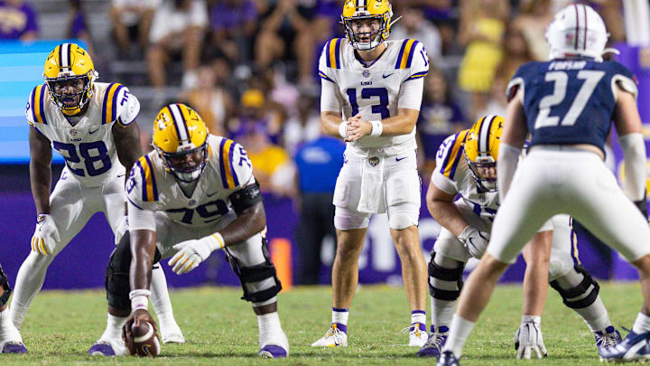 Sep 28, 2024; Baton Rouge, Louisiana, USA; LSU Tigers quarterback Garrett Nussmeier (13) waits for the snap from offensive lineman DJ Chester (79) against the South Alabama Jaguars during the second half at Tiger Stadium. Mandatory Credit: Stephen Lew-Imagn Images Sep 28, 2024; Baton Rouge, Louisiana, USA; LSU Tigers quarterback Garrett Nussmeier (13) waits for the snap from offensive lineman DJ Chester (79) against the South Alabama Jaguars during the second half at Tiger Stadium. Mandatory Credit: Stephen Lew-Imagn Images