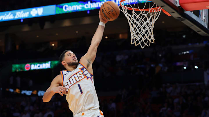 Jan 13, 2026; Miami, Florida, USA; Phoenix Suns guard Devin Booker (1) dunks against the Miami Heat during the third quarter at Kaseya Center. Mandatory Credit: Sam Navarro-Imagn Images