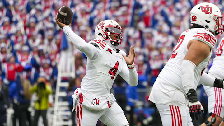 Utah Utes quarterback Devon Dampier throws a pass against Kansas.