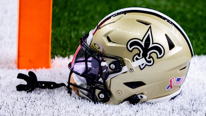 Sep 8, 2024; New Orleans, Louisiana, USA;  Detailed view of the New Orleans Saints football helmet before the game against the Carolina Panthers during the pregame at Caesars Superdome. Mandatory Credit: Stephen Lew-Imagn Images